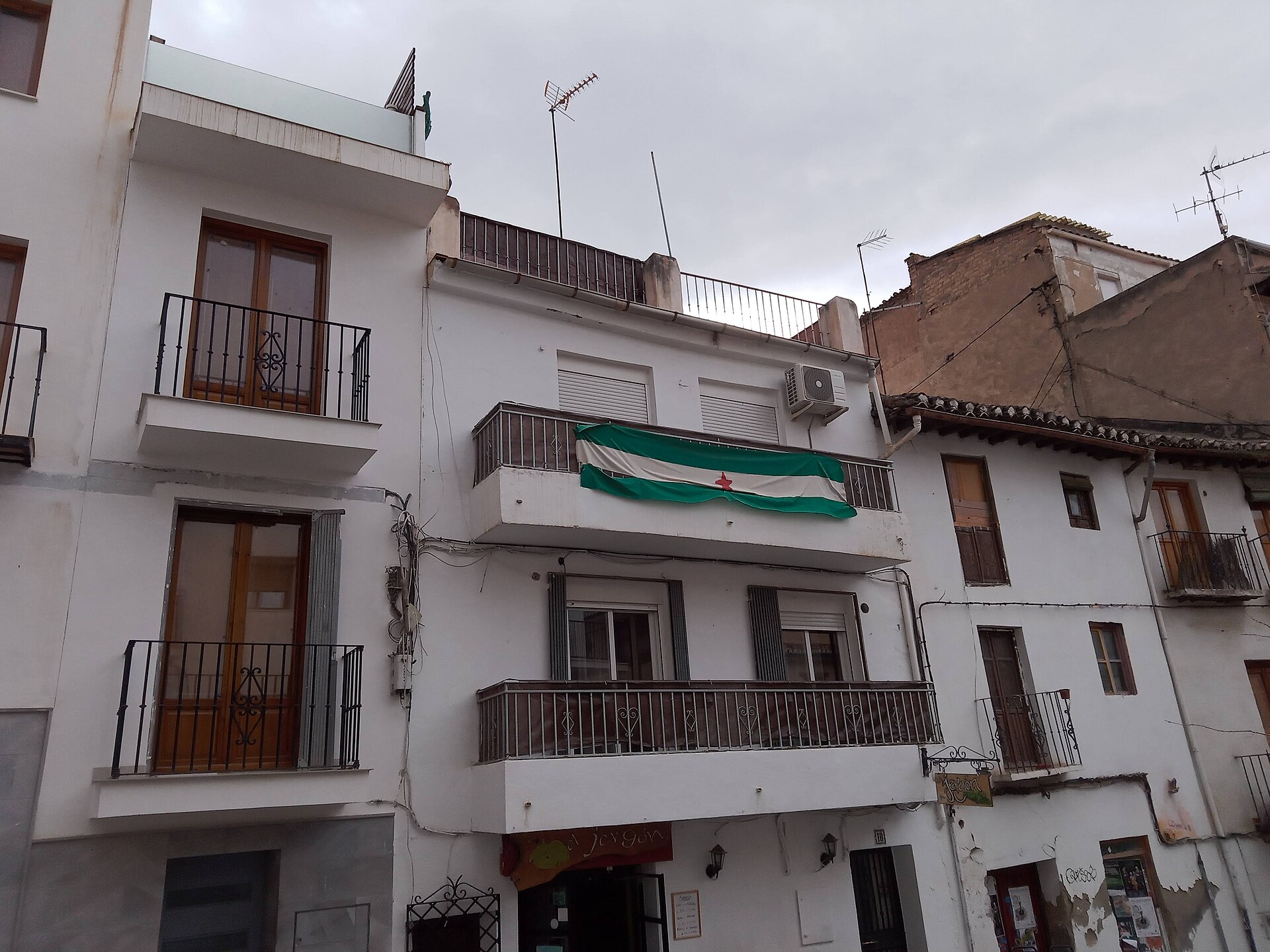 White apartment building with balconies in the Realejo